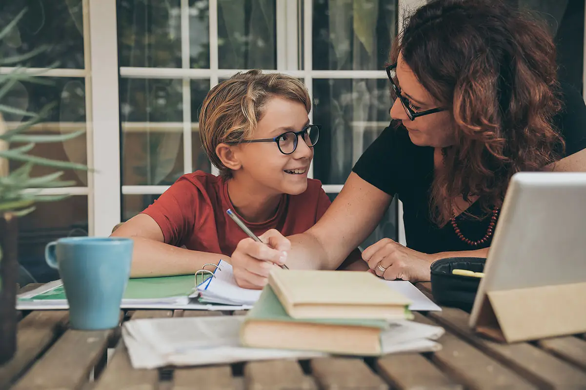 a mom studying with her child while home schooling with a Christ-Centered Mindset