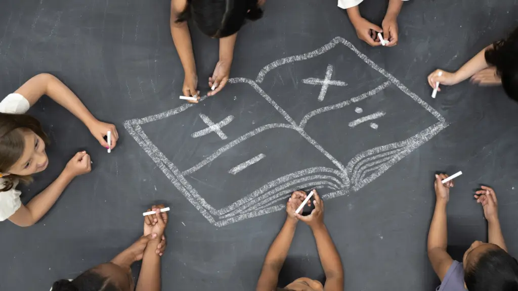 children drawing in chalk a book with math symbols showing biblical integration in math