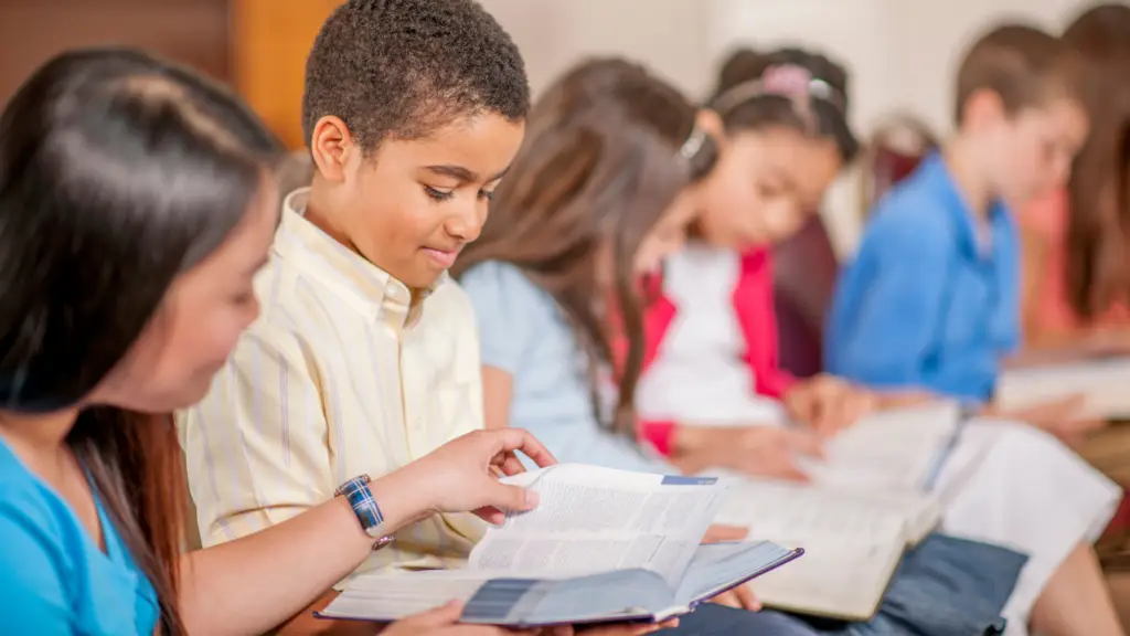 school children sitting at school learning biblical integration in language arts together